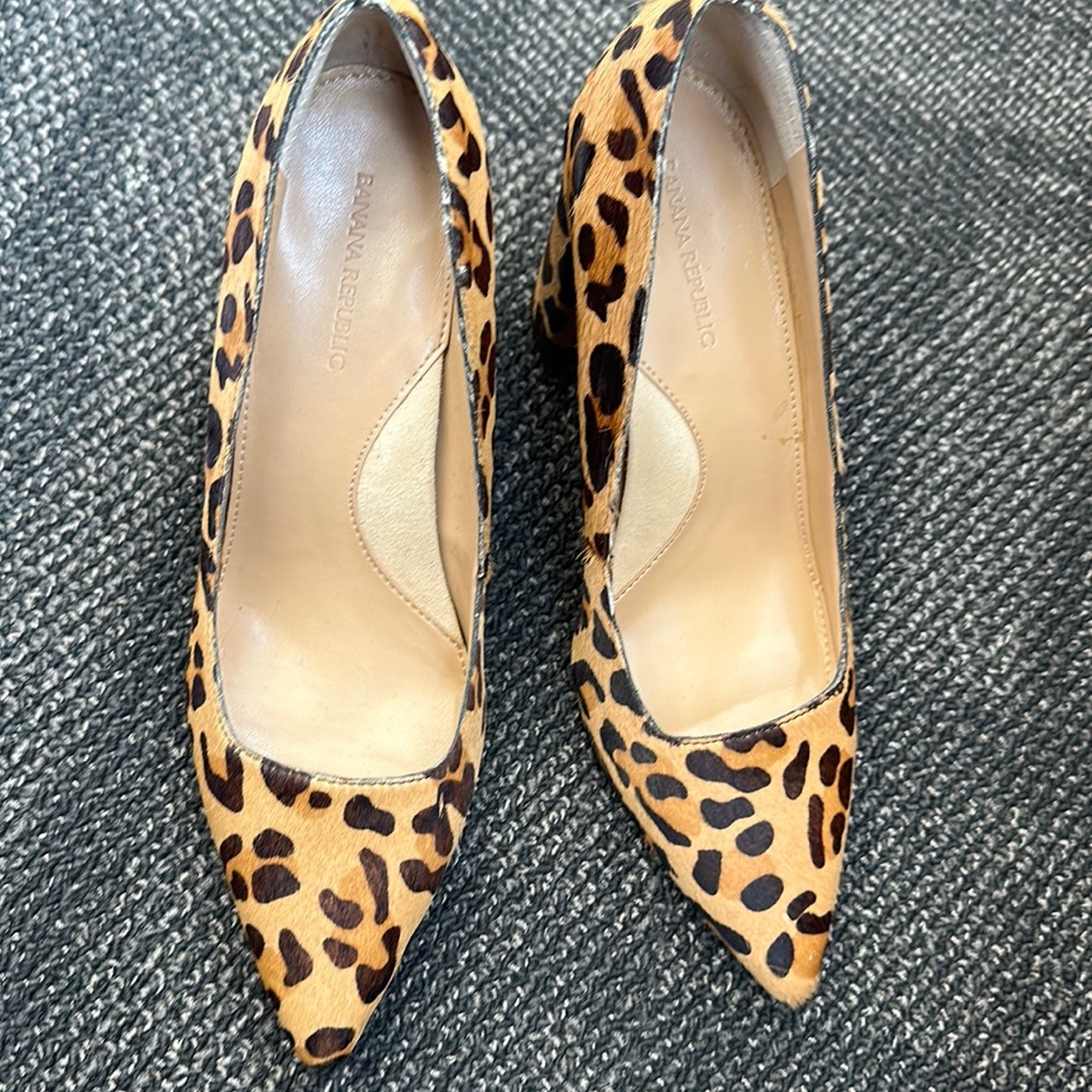 Leopard cow hide fur pumps.